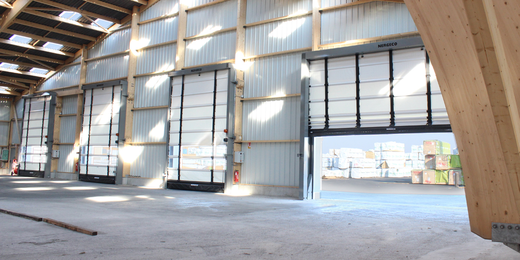 High-speed doors installed on a wooden-frame building